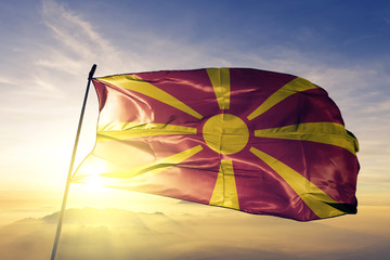 Macedonia flag waving on the top sunrise mist fog