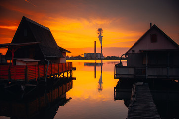 Power plant releasing fumes next to the lake