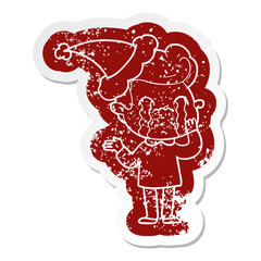 cartoon distressed sticker of a man crying wearing santa hat