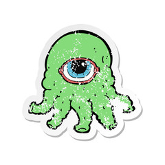 retro distressed sticker of a cartoon alien head