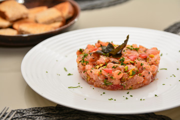 Fresh Salmon Tartar with pistachio, basil and herbs