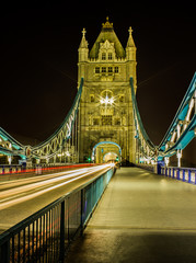 Fototapeta na wymiar A night long exposure of the Tower bridge with trafic light trails