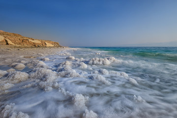 Fototapeta na wymiar Dead Sea, Ein Bokek, Israel - February 18: Sunrise at the Dead Sea of Ein Bokek Dead Sea, Israel 