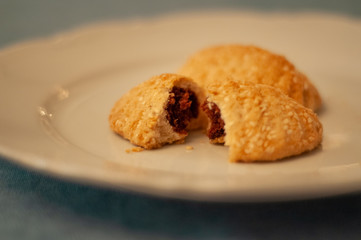 Home made cookie on white dish.