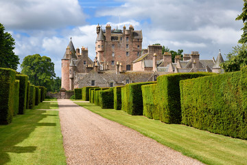 Red stone path with yew hedges in east Italian Garden of Glamis Castle home of Earl and Countess of Strathmore and Kinghorne Scotland UK