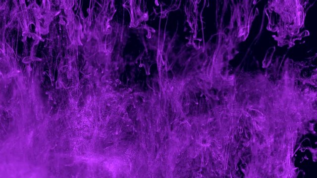 Purple ink in water. Violet with glitter paint reacting in water creating abstract cloud formations.Can be used as transitions,added to modern projects,art backgrounds, anything with creative twist.