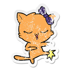 distressed sticker of a cartoon cat with bow on head
