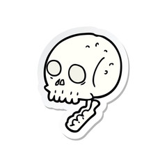 sticker of a cartoon spooky skull
