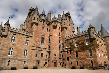 Red stone of the front of Glamis Castle home of the Earl and Countess of Strathmore and Kinghorne Scotland UK