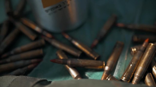 M16 automatic rifle bullets on table.