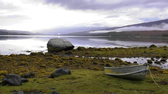 Looking across Loch Eil in Scotland on a misty calm morning with soft light.