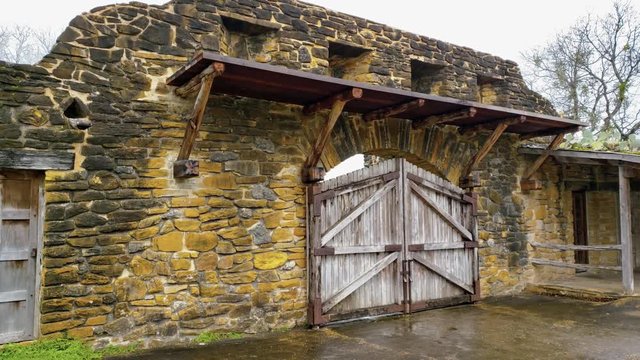 old fort gates and housing in compound of chapel mission grounds