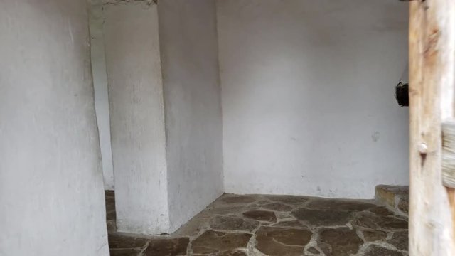 first person view coming backing out of old mission house showing fireplace and interior