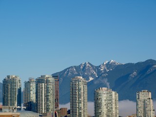 Skyline in Vancouver, BC with condos and mountains