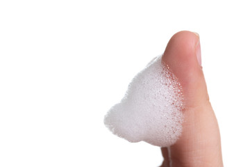 White foam bubbles texture with child finger and hand  isolated on white