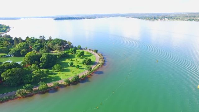 Drone / aerial footage above Brasilia's lake (Lago Paranoa), Brazil capital's - summer season.