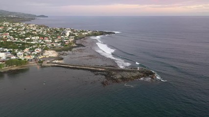 Elevated aerial view over the Saint Pierre lighthouse at dusk on Reunion Island