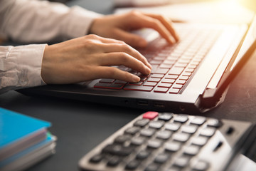 man hand keyboard and calculator