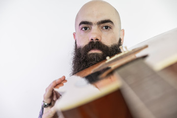 Bearded musician with his guitar