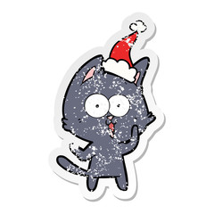 funny distressed sticker cartoon of a cat wearing santa hat