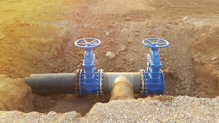 Blue butterfly valve on floor and PE. black pipe for raw water pump
