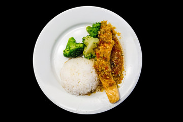 Preparation of Breakfast, Steamed salmon and rice in black background.