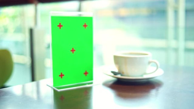 Green screen design with menu board in coffee shop