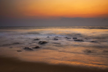 Fototapeta na wymiar Long exposure of sunset on the beach