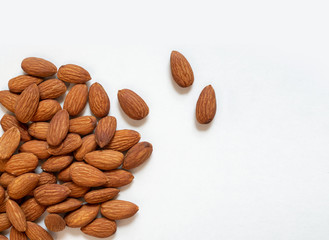 Roasted almonds on white background