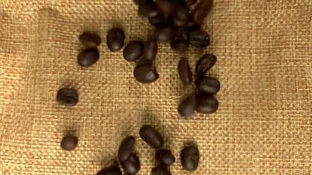 Coffee beans falling in slow motion