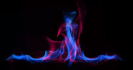 Multi Color Fire Flame Abstract on black background. A mystic colorful smoke. Blurry bright abstraction with colored lines. Magic fire 