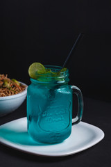 Blue mojito in a mason jar