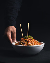 Serving a noodle bowl