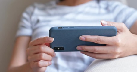 Close up of woman watch on smart phone