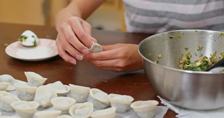 Woman make with chinese meat dumpling