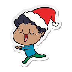 laughing sticker cartoon of a man running wearing santa hat