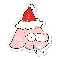 distressed sticker cartoon of a elephant face wearing santa hat
