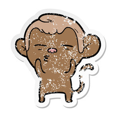 distressed sticker of a cartoon suspicious monkey