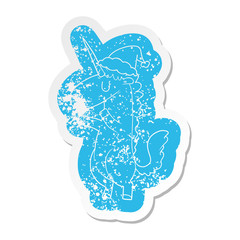 cartoon distressed sticker of a unicorn wearing santa hat