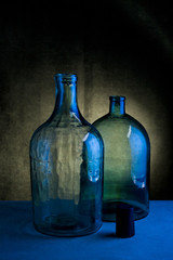 Still life with two glass bottles