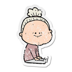 distressed sticker of a cartoon happy old woman