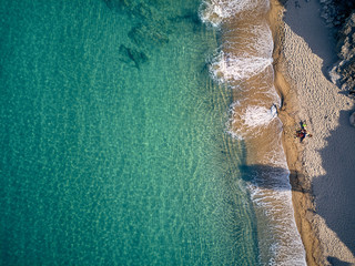 Fototapeta na wymiar Beautiful beach with family top view shot