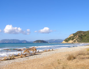 Fototapeta na wymiar View of Gerak s beach with sunbeds and umbrellas,