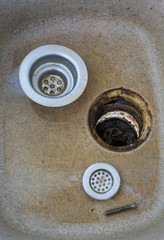 Clogged kitchen sink in the kitchen. Cleaning a clogged, dirty washbasin
