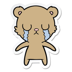 sticker of a crying cartoon bear