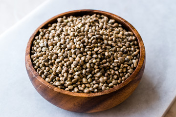 Organic Roasted Hemp Seeds in Wooden Bowl.