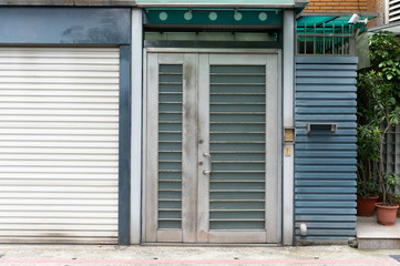 Obraz premium sidewalk by street wall & door