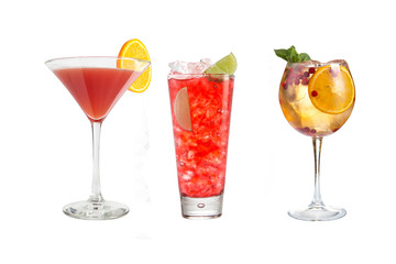 A variety of alcoholic drinks, beverages and cocktails on a white background. Three drinks in different glass glasses with decoration.