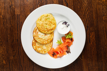potato pancakes with smoked salmon and sour cream
