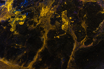 Fototapeta premium Creative gold black abstract hand painted background wallpaper texture design close-up fragment motion stains of fluid acrylic watercolor oil painting picture canvas Modern Contemporary piece of art